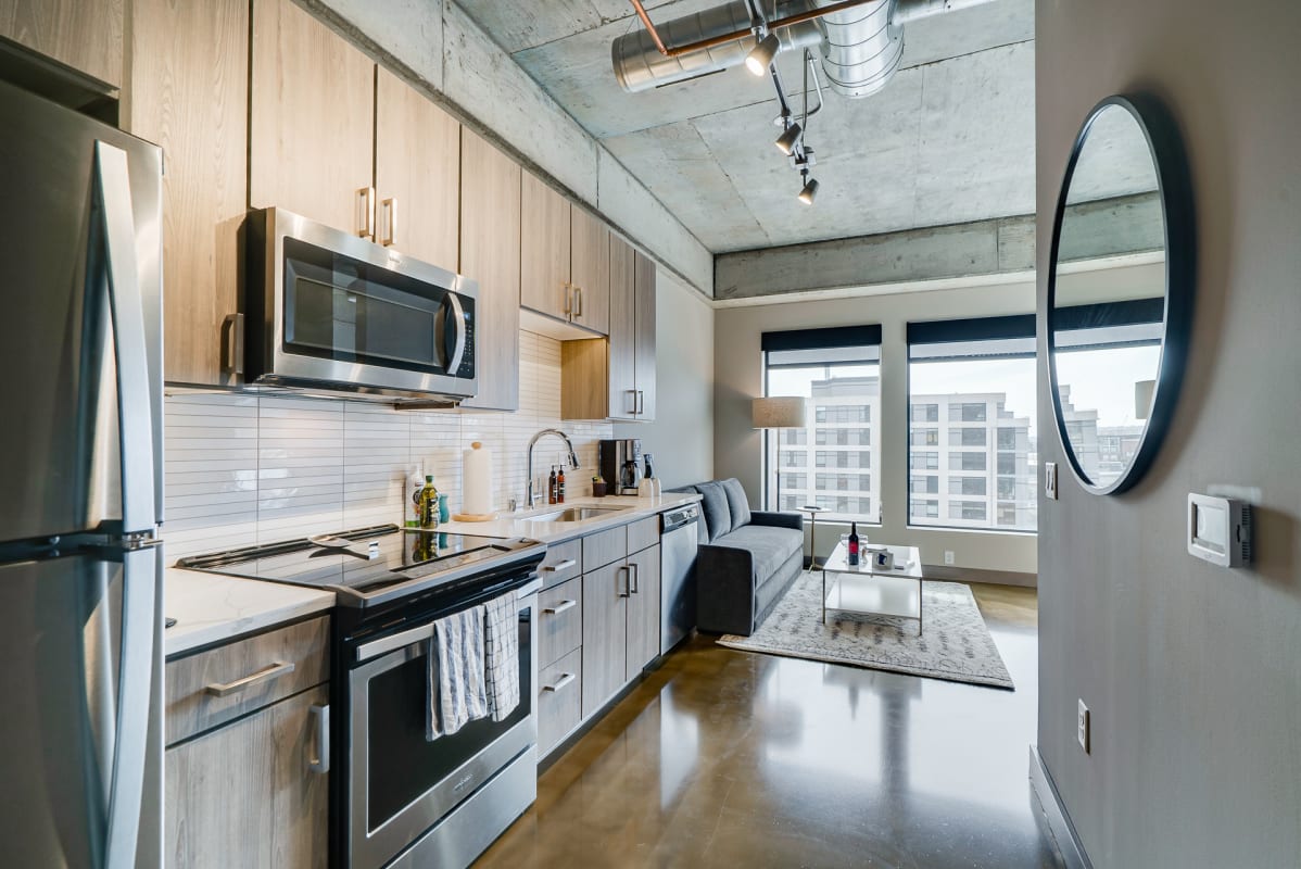 Your modern loft blends industrial charm with sleek finishes—exposed concrete ceilings, polished floors, and a fully equipped kitchen perfect for urban stays.