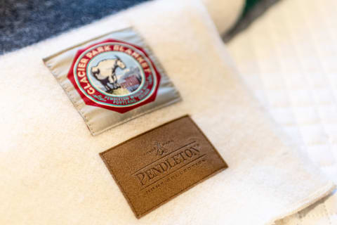 Detailed view of a Pendleton wool blanket with Glacier Park patches.