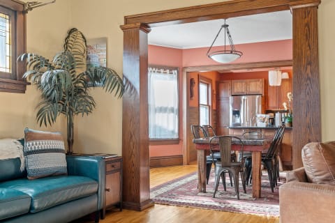 Cozy living room and dining area with modern and rustic decor.