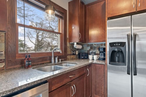 Your fully-equipped kitchen features granite counters, stainless appliances, and a coffee maker for perfect morning brews.