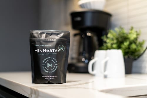 Wake up to premium coffee awaiting you in your kitchen, complete with modern brewing equipment for your perfect morning ritual.