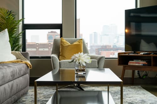 Unwind in your stylish living room with city views, plush seating, and modern entertainment center for perfect relaxation.